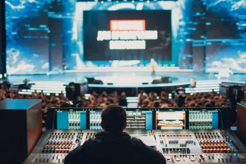 audio engineer working on a console